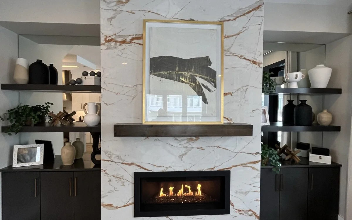 Modern fireplace feature wall with stone surround and built-in display shelving